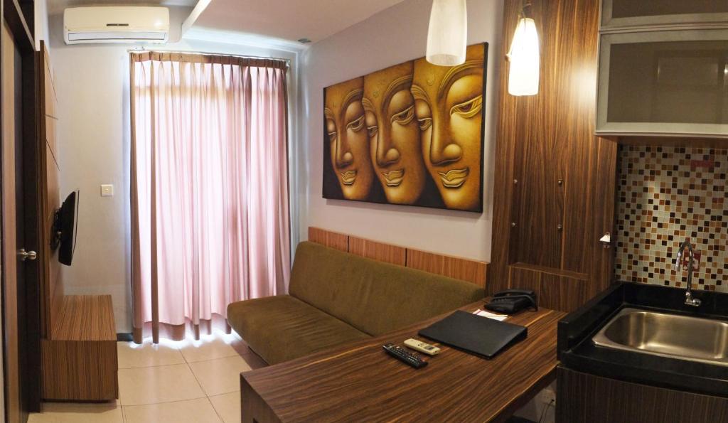 TV a/nebo společenská místnost v ubytování Valore Hotel