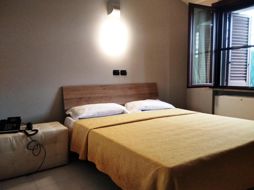 Postel nebo postele na pokoji v ubytování Hotel Motel Est