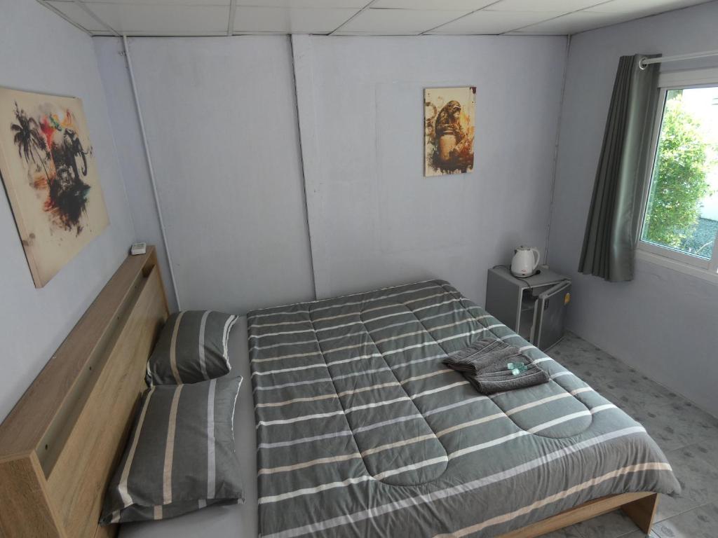Postel nebo postele na pokoji v ubytování Lemon Guesthouse