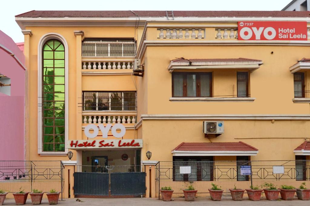 a building with a sign on the side of it at Hotel Sai Leela in Puri