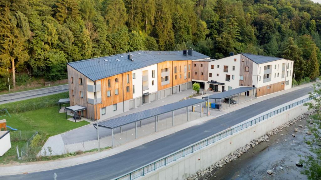 an aerial view of a building next to a road at Resort Vrchlabí in Vrchlabí