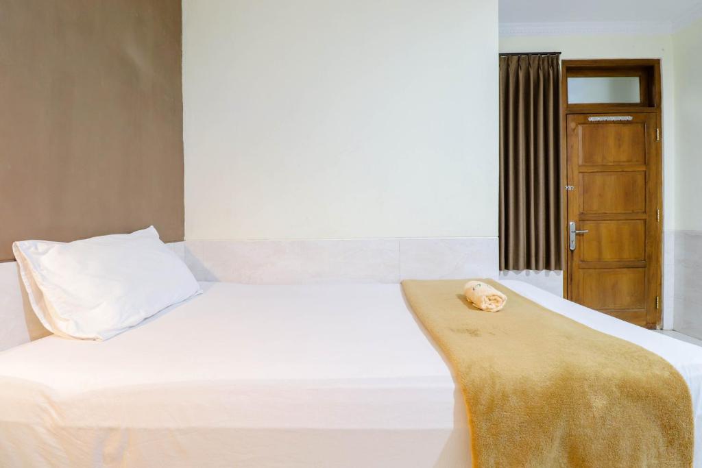 Letto o letti in una camera di Hotel Safara Yogyakarta