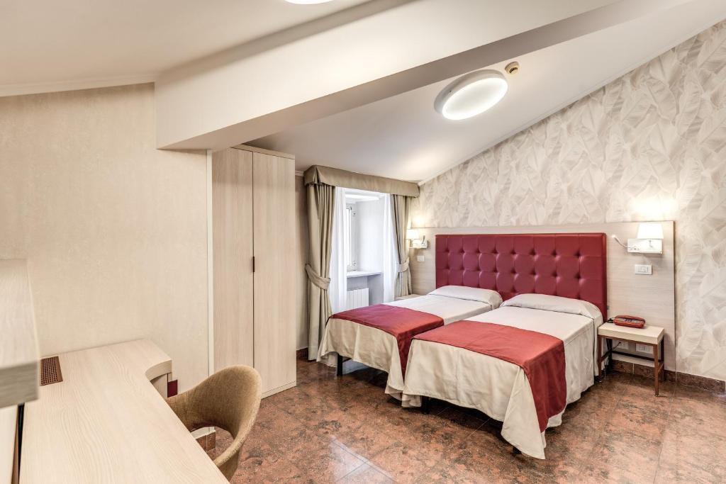 Postel nebo postele na pokoji v ubytování Hotel Milo