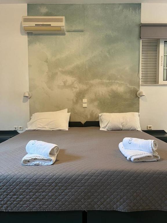 Postel nebo postele na pokoji v ubytování Cost Mari Almyrida New by ZAGO Boutiqe hotels