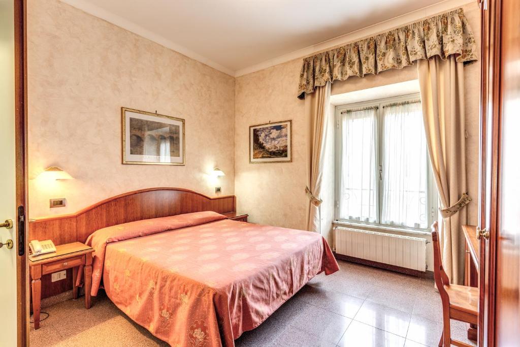 Postel nebo postele na pokoji v ubytování Hotel Milo