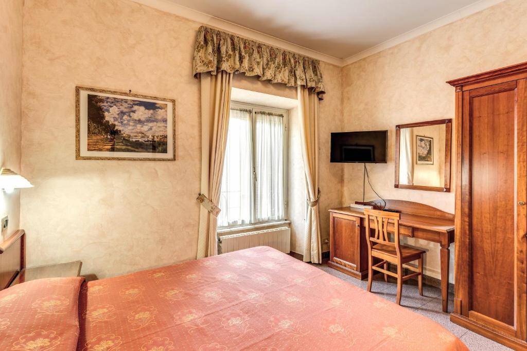 Postel nebo postele na pokoji v ubytování Hotel Milo