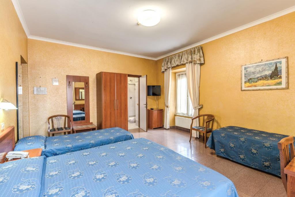 Postel nebo postele na pokoji v ubytování Hotel Milo