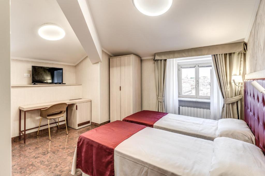 Postel nebo postele na pokoji v ubytování Hotel Milo