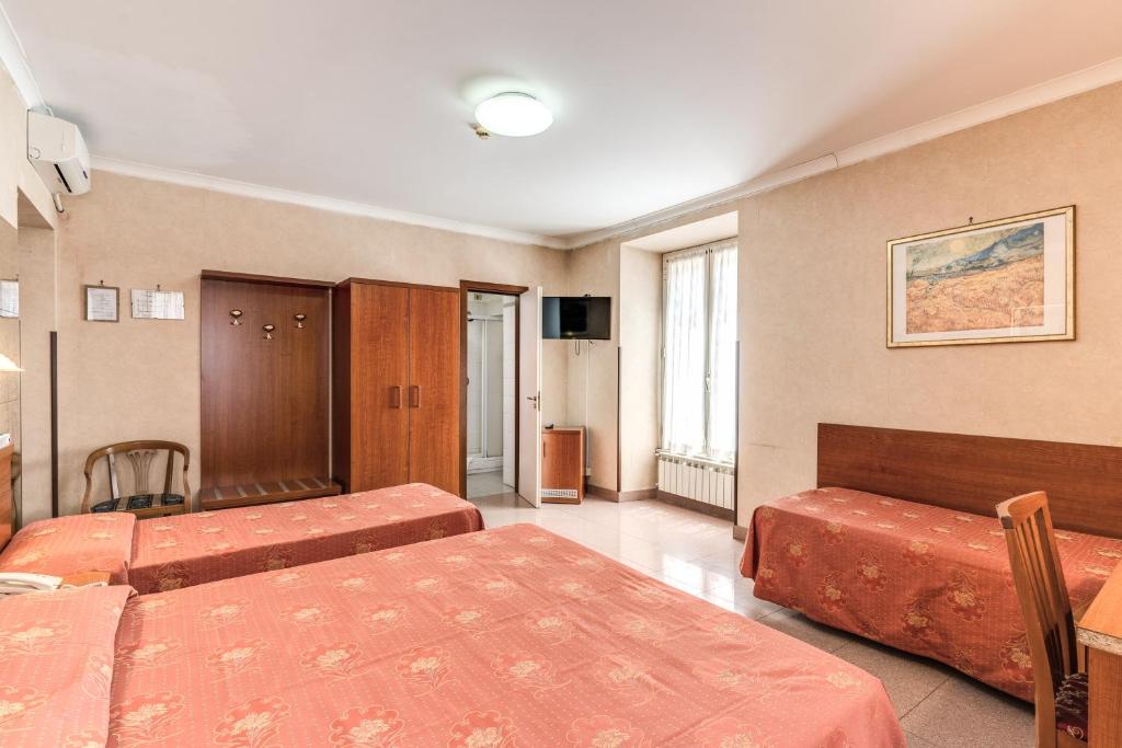 Postel nebo postele na pokoji v ubytování Hotel Milo