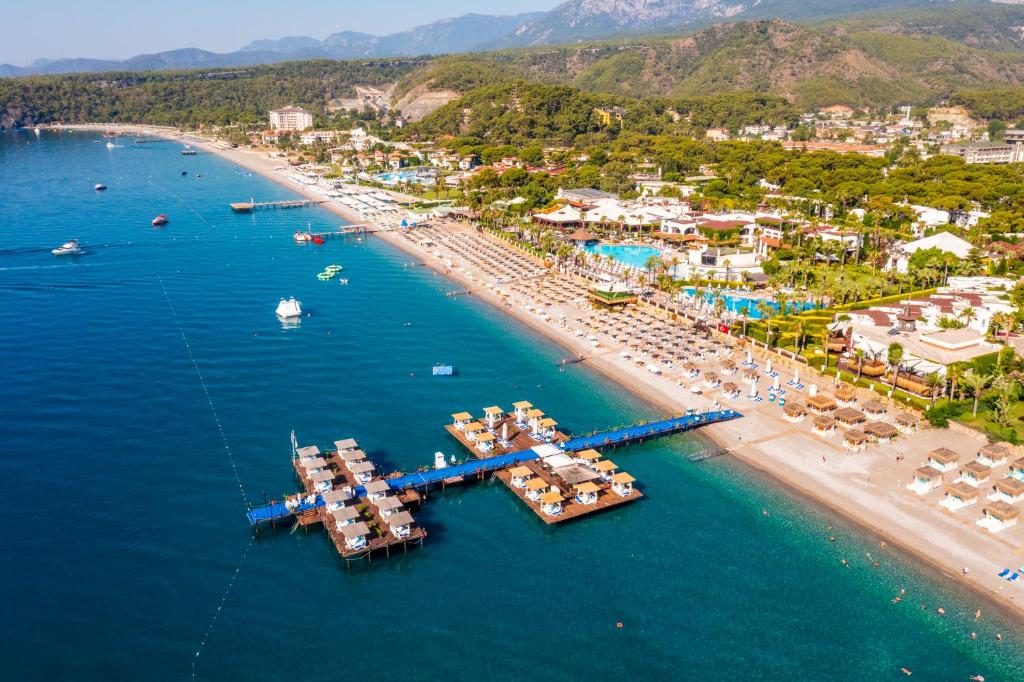 an aerial view of a beach with boats in the water at Emelda Sun Club in Kemer