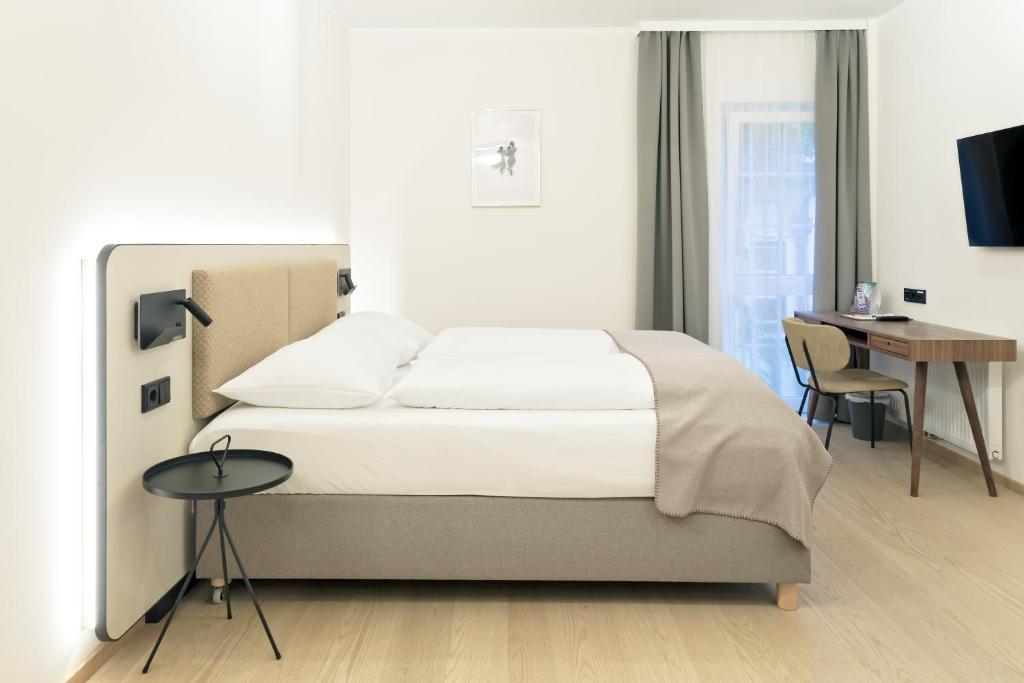 Llit o llits en una habitació de Gasthof Scherzl