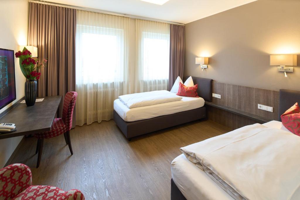 Postel nebo postele na pokoji v ubytování Hotel Staffler