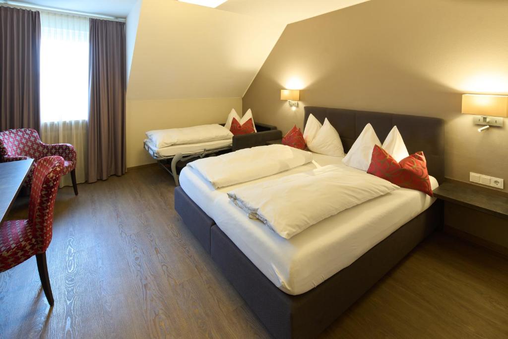 Postel nebo postele na pokoji v ubytování Hotel Staffler