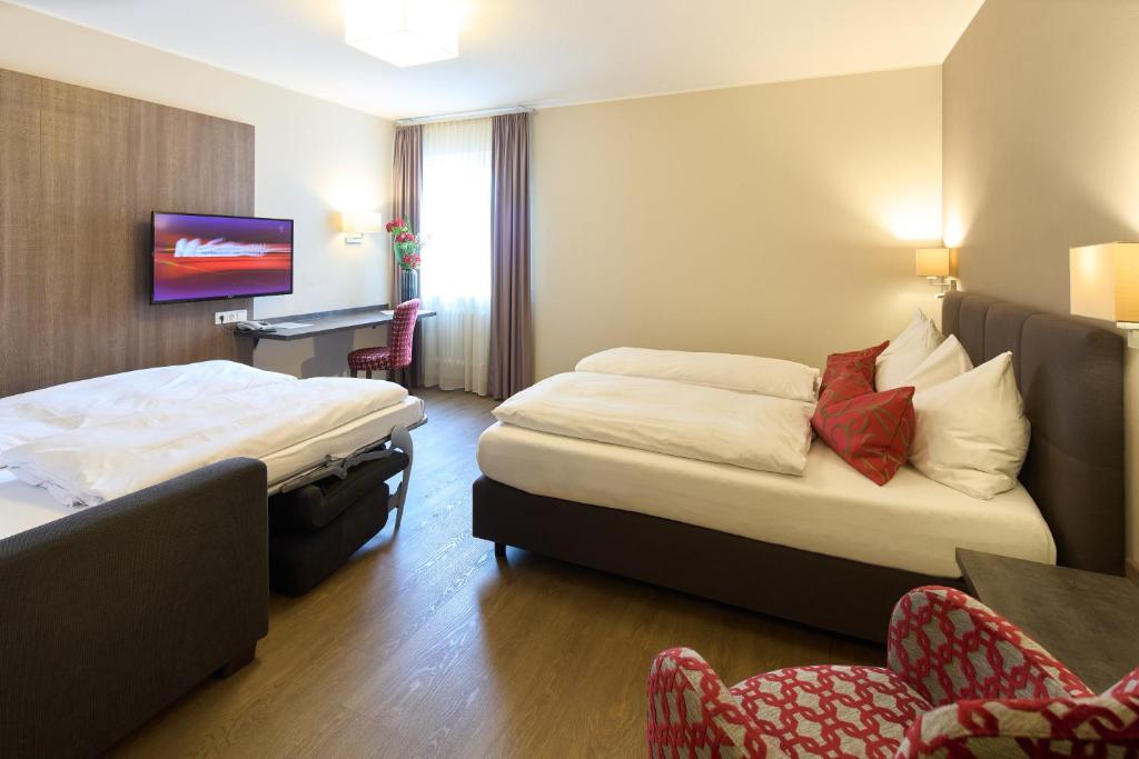Postel nebo postele na pokoji v ubytování Hotel Staffler