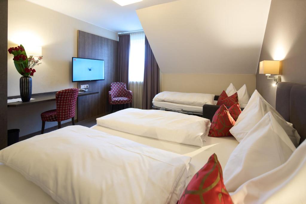 Postel nebo postele na pokoji v ubytování Hotel Staffler