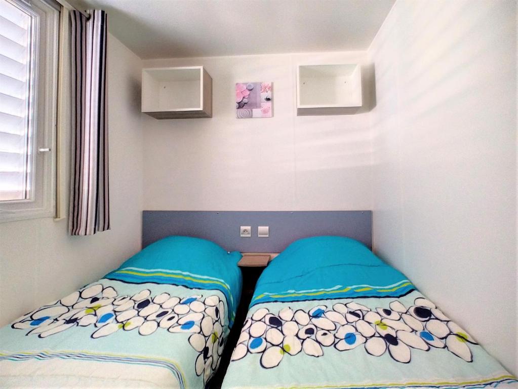 Postel nebo postele na pokoji v ubytování Mobil Home 6/8 Places vue dégagée