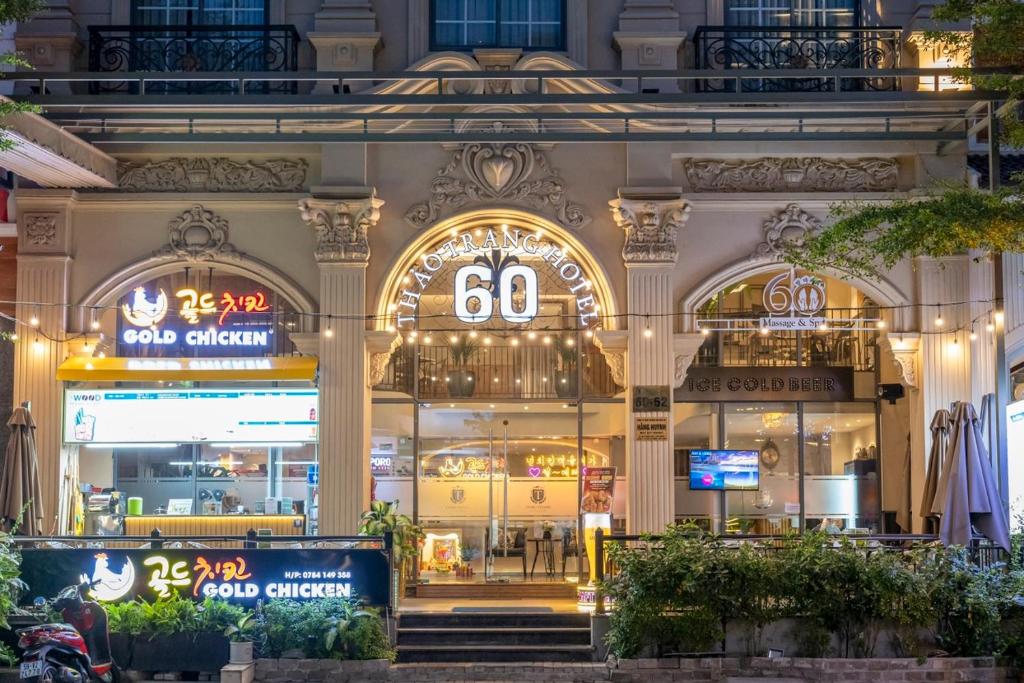a store front of a building at night at Thao Trang Laluxe Hotel Phu My Hung in Ho Chi Minh City