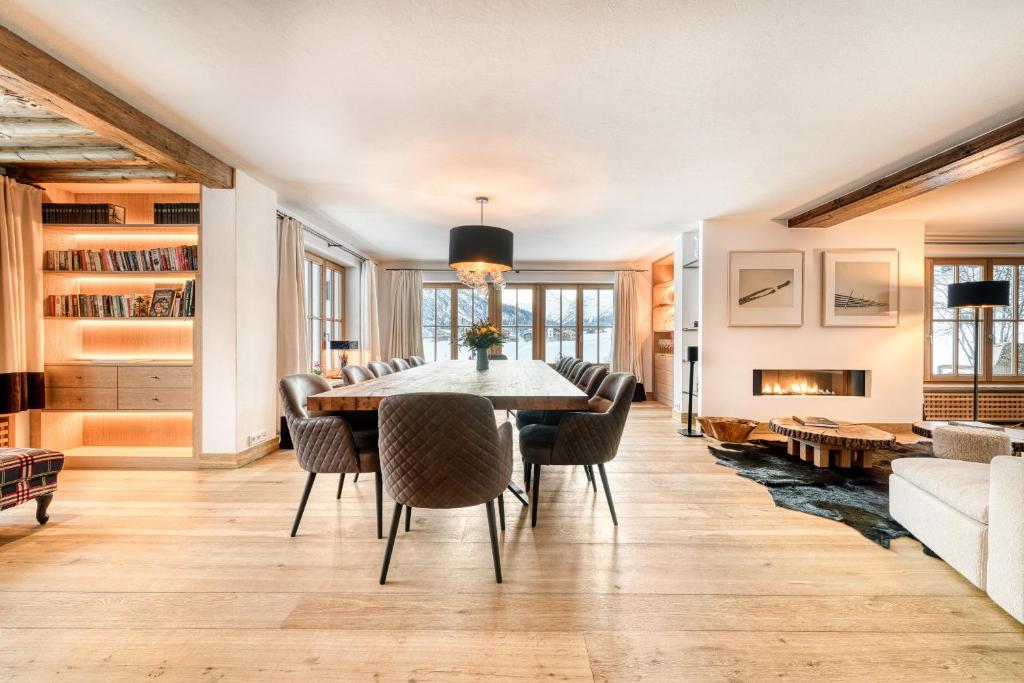 a dining room with a table and chairs at Chalet Lilly - Luxury by A-Appartments mit Ski in - Ski out in Zug