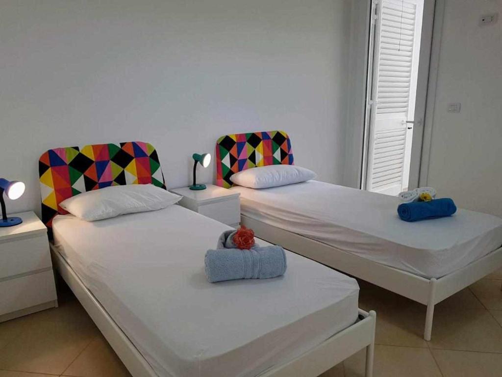 Postel nebo postele na pokoji v ubytování Residence Boccaccio
