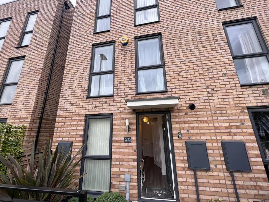 a brick building with a door in front of it at Luxury 10 Bed Palace w/ Parking in Birmingham