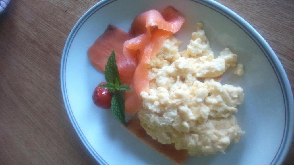a plate of food with mashed potatoes and fruit on it at Aurora House Bed And Breakfast in Athy