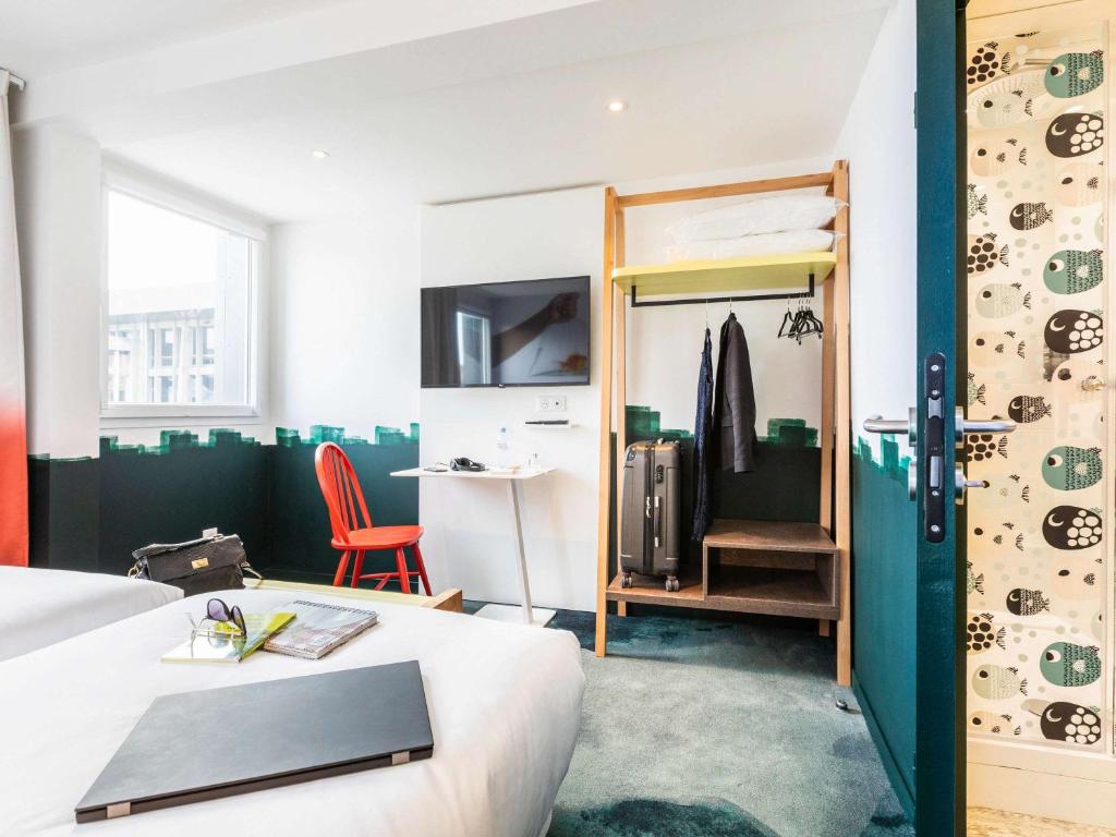 Postel nebo postele na pokoji v ubytování ibis Styles Thonon-les-Bains