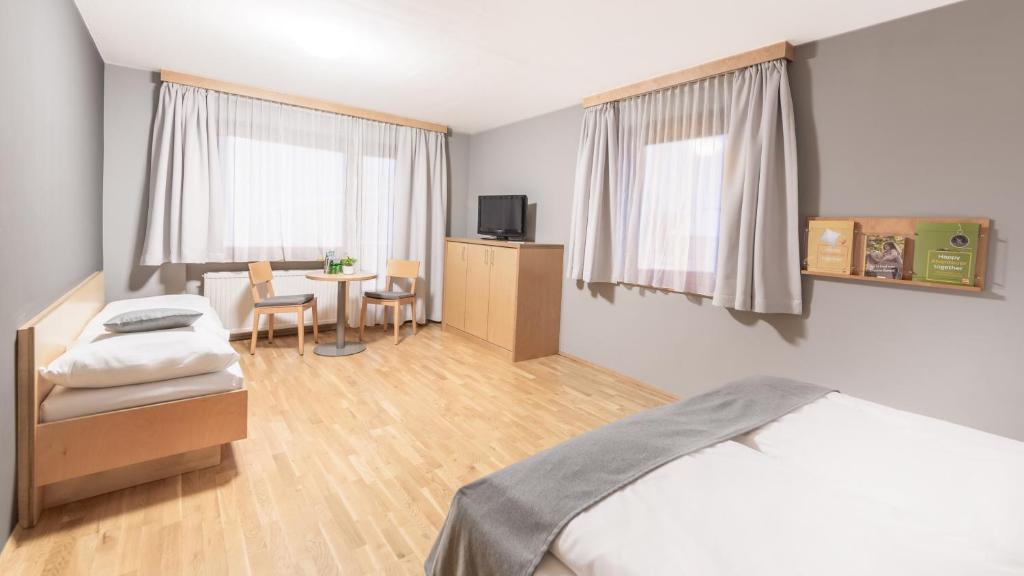 Postel nebo postele na pokoji v ubytování JUFA Hotel Montafon