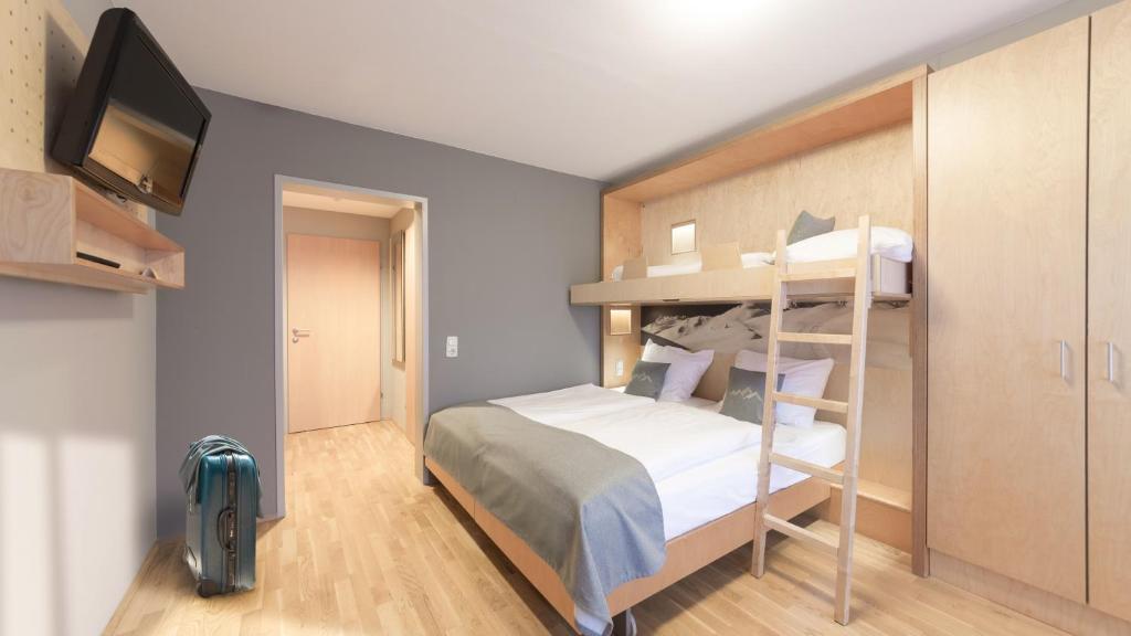 Postel nebo postele na pokoji v ubytování JUFA Hotel Montafon