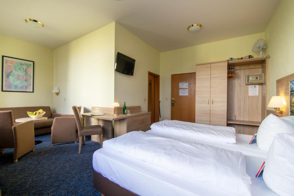 Postel nebo postele na pokoji v ubytování Seehotel Grunewald