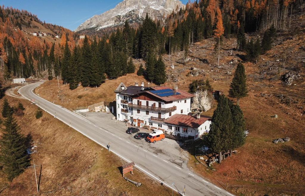 an aerial view of a house on a road at La Baita in Livinallongo del Col di Lana