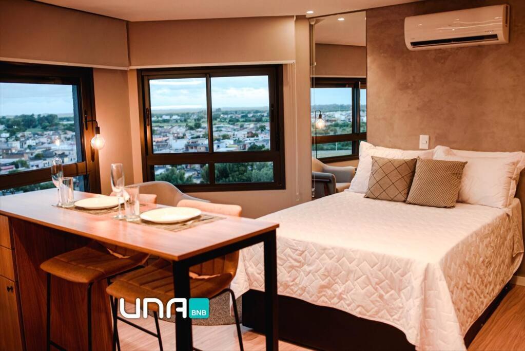 En eller flere senge i et værelse på Loft com vista para o Parque Una