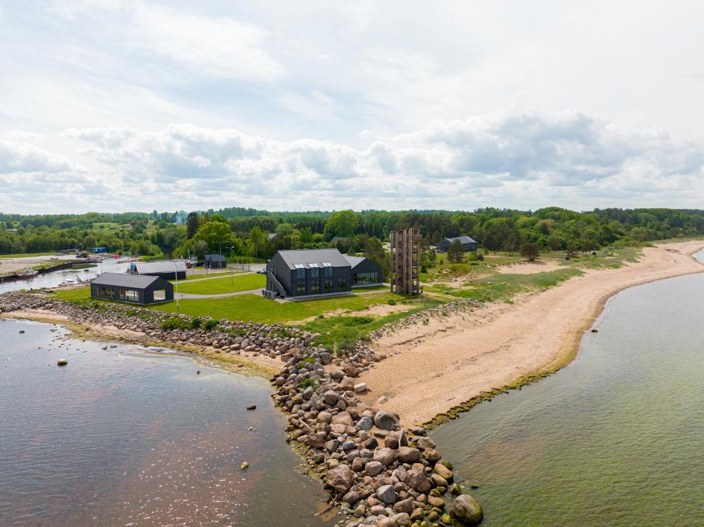 an aerial view of a house on a beach next to the water at Tulivee Villa in Liimala