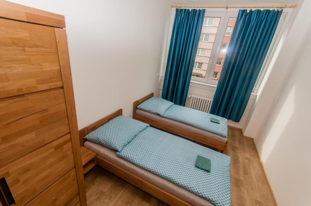 Postel nebo postele na pokoji v ubytování Hostel Favorit