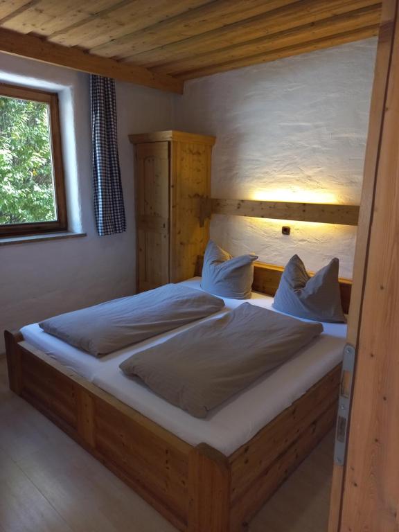 Postel nebo postele na pokoji v ubytování Scheffauerhof