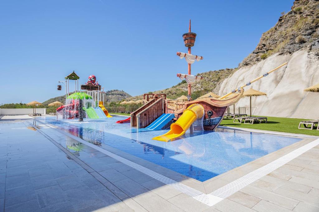 a large swimming pool with a water slide at Apartamentos Turísticos Best Indalo in Mojácar