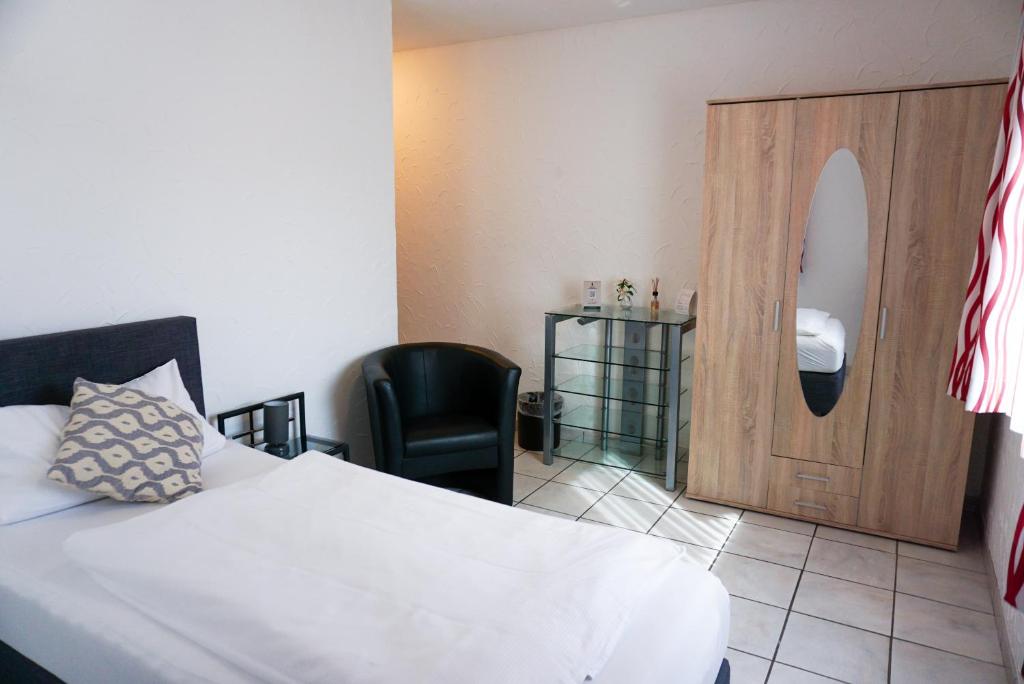 Postel nebo postele na pokoji v ubytování Hotel zur Schlemmerscheune