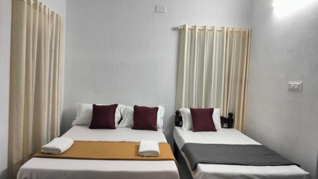 Letto o letti in una camera di Guestland Homestay
