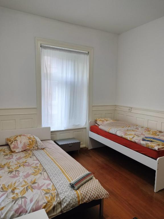 Postel nebo postele na pokoji v ubytování City Home Zurich