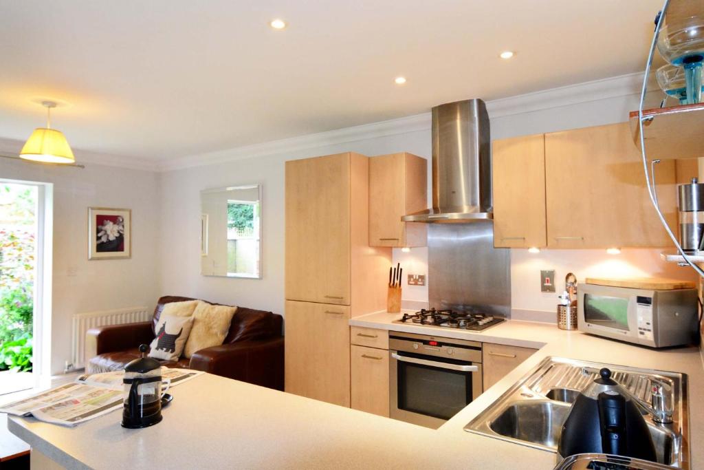 a kitchen with a sink and a stove top oven at Elizabeth Jennings Way in Oxford