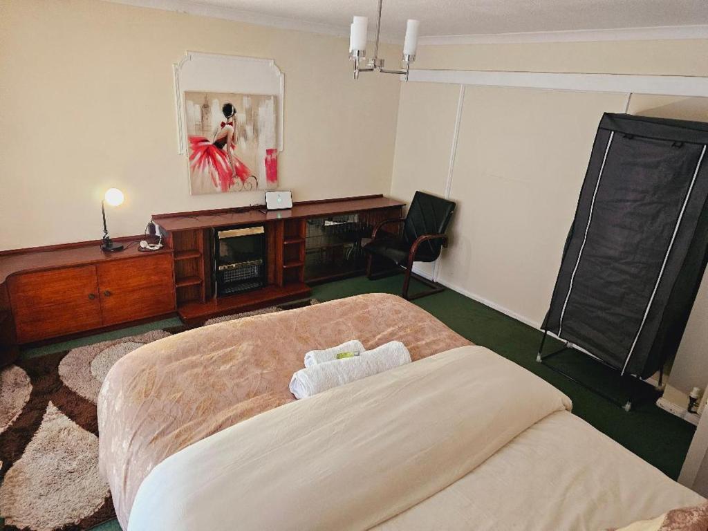 Postel nebo postele na pokoji v ubytování Haven Home