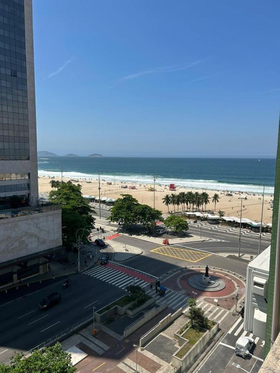 a view of a street with the beach in the background at COPACABANA RIO PRAIA 15 in Rio de Janeiro