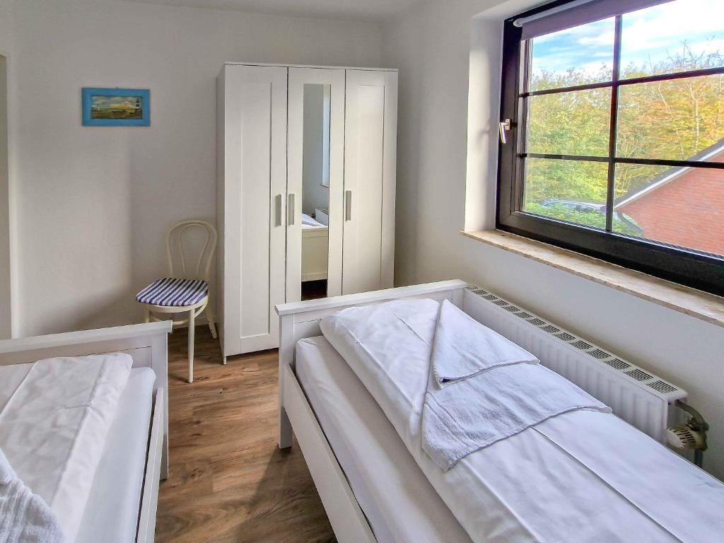 Postel nebo postele na pokoji v ubytování Seezunge