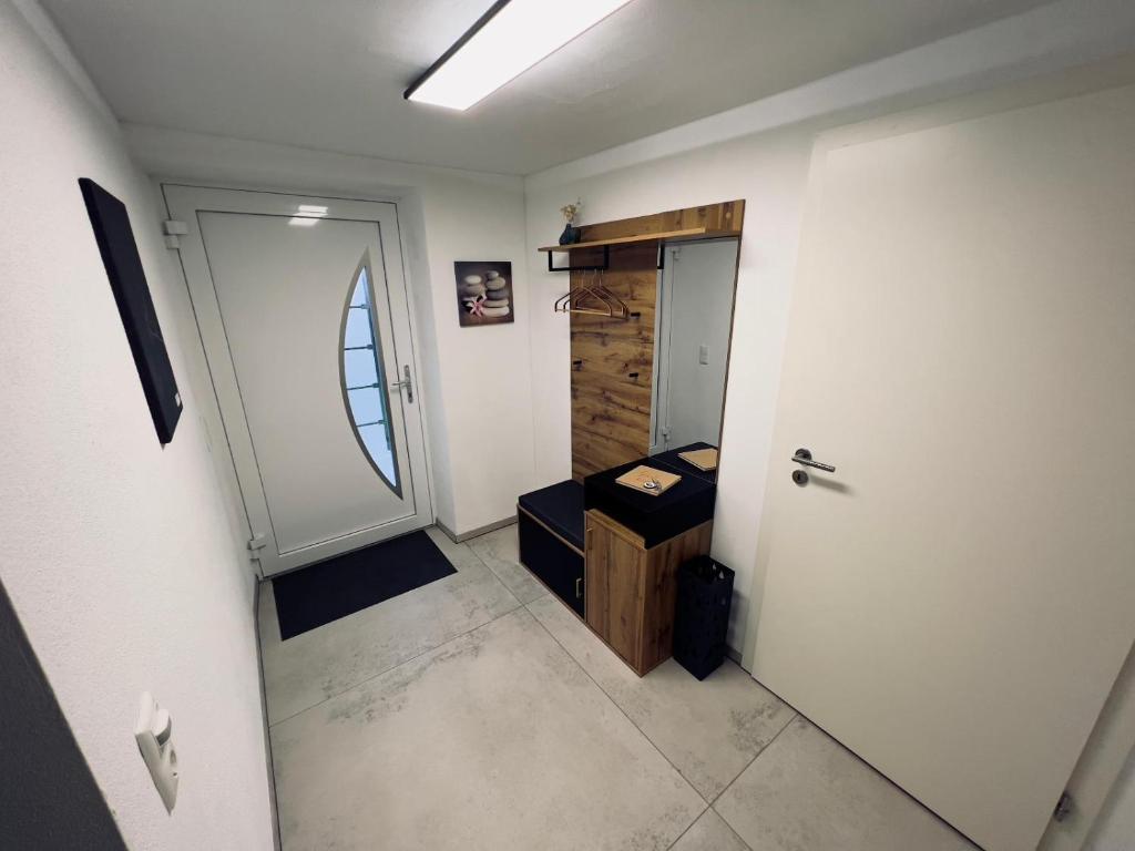 a room with a hallway with a door and a drawer at Ferienwohnung Traum am Berg in Zwiesel