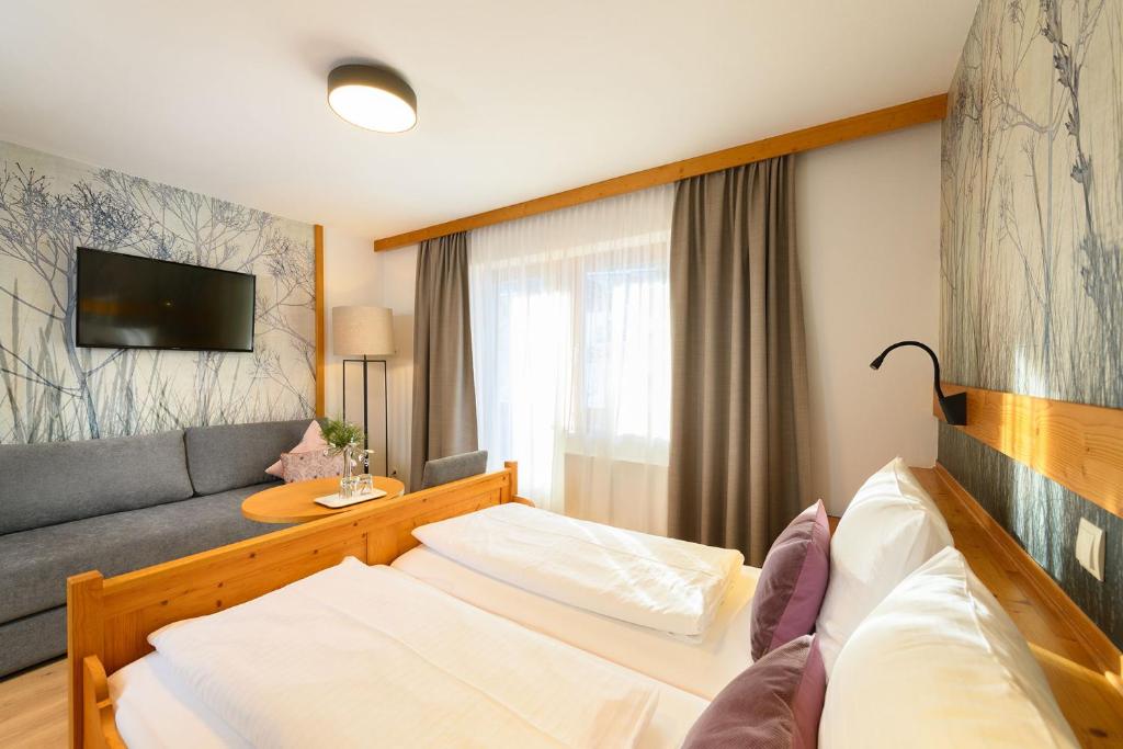 Postel nebo postele na pokoji v ubytování Hotel Vierjahreszeiten