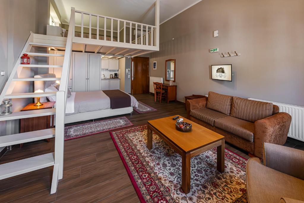 Postel nebo postele na pokoji v ubytování Ef Zin Hotel Arachova
