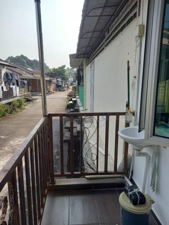 a balcony with a sink on a building at Bilik Transit Nilai in Nilai