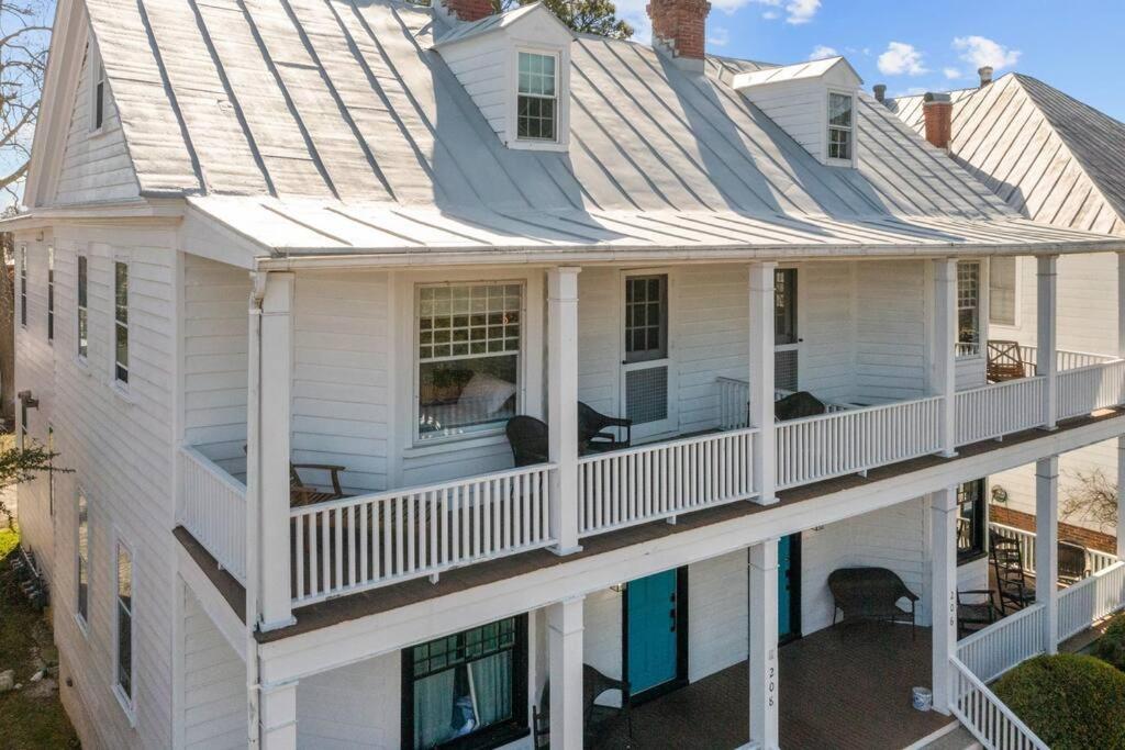 an aerial view of a white house with a balcony at Spaight House Suite in New Bern