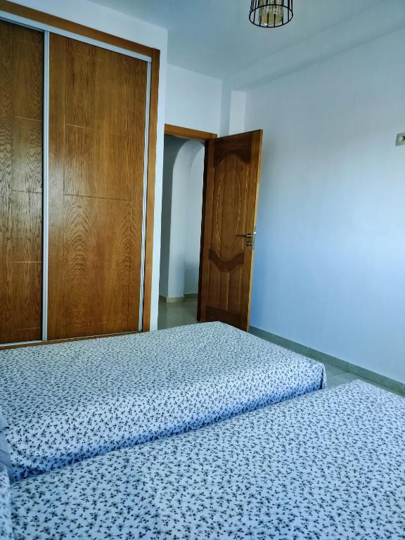 Postel nebo postele na pokoji v ubytování Oued laou beach