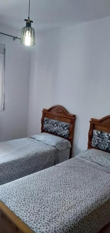 Postel nebo postele na pokoji v ubytování Oued laou beach