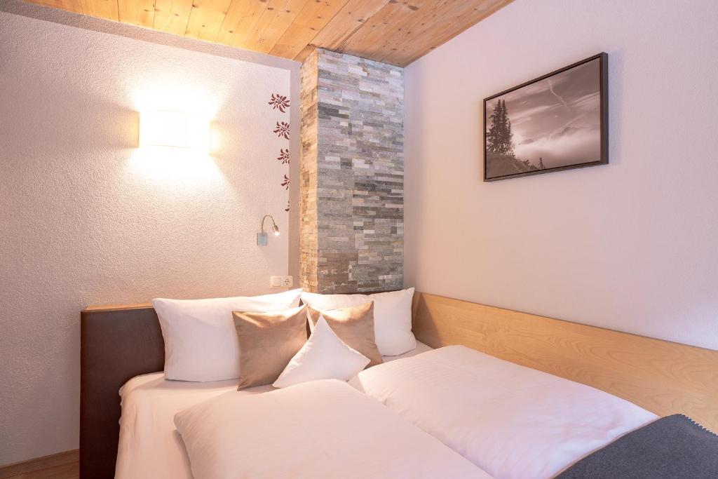 Postel nebo postele na pokoji v ubytování Patteriol Apart-Hotel-Garni
